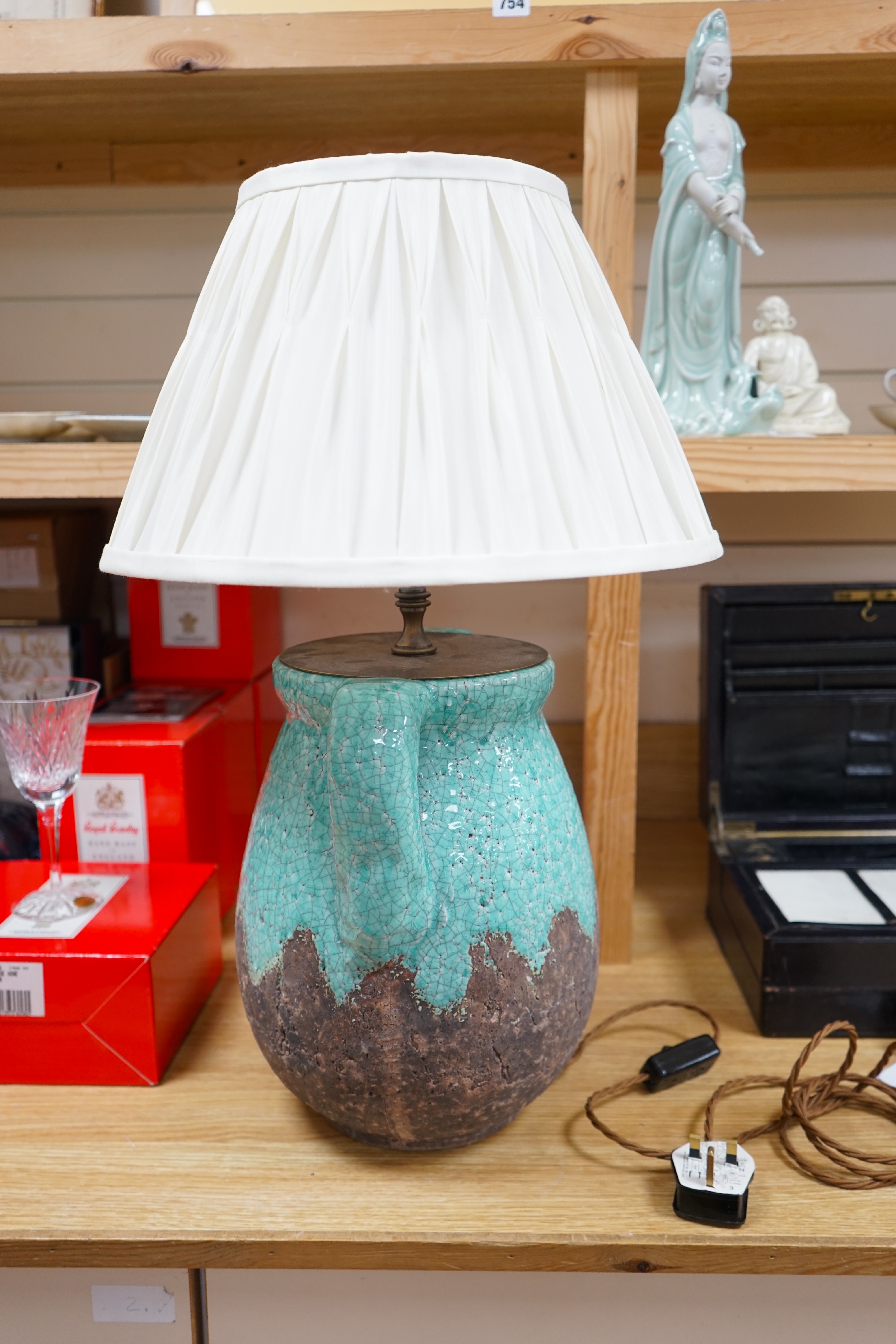 A turquoise lava ceramic table lamp with fabric shade, wired, 61cm to top of shade, 33cm high excluding the fitting and shade. Condition - good, untested